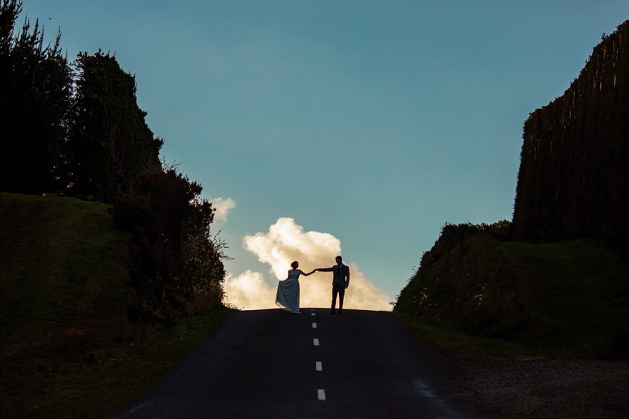 New Zealand Elopement couple cloud top of road