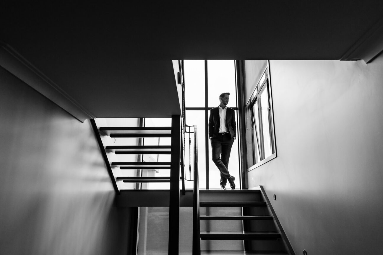 Groom in stairwell before wedding