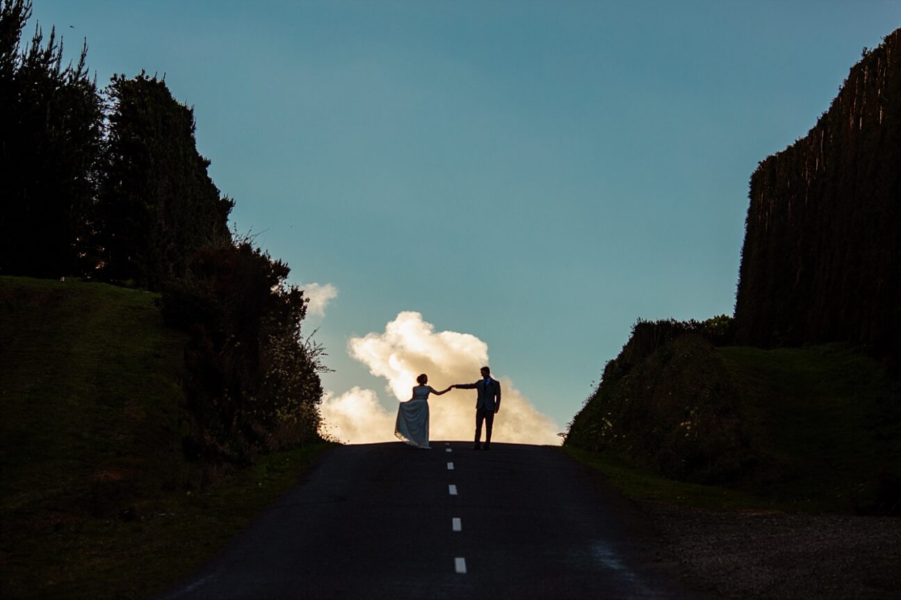 New Zealand Elopement couple cloud top of road