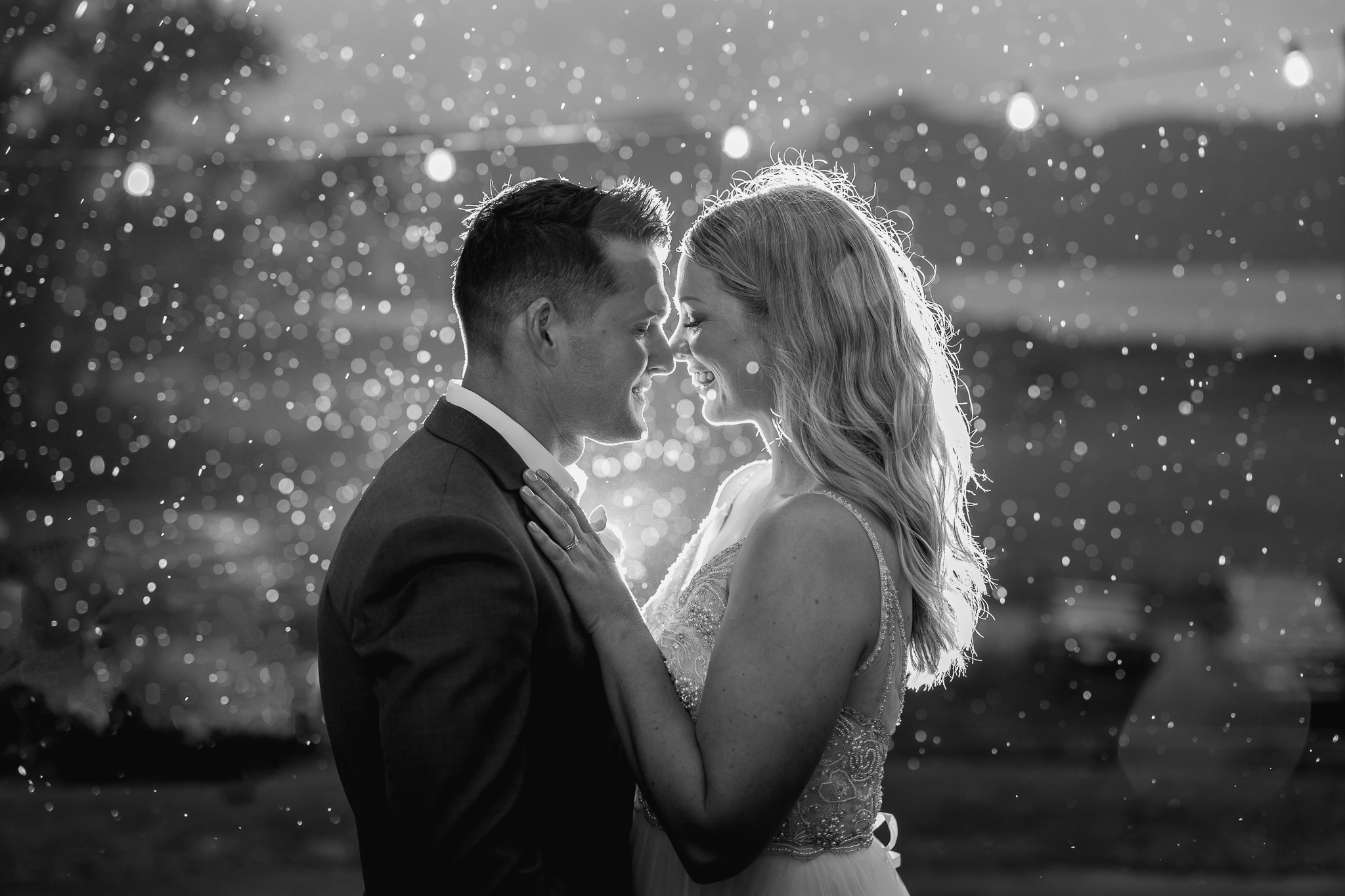 Soft evening rain falls on bride and groom at Longfords Estate Roturua