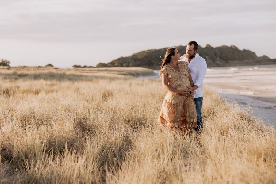 Golden hour photos of maternity session natural photos in sand dunes
