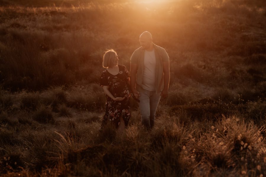 Sun back lighting in the sand dunes of maternity beach shoot