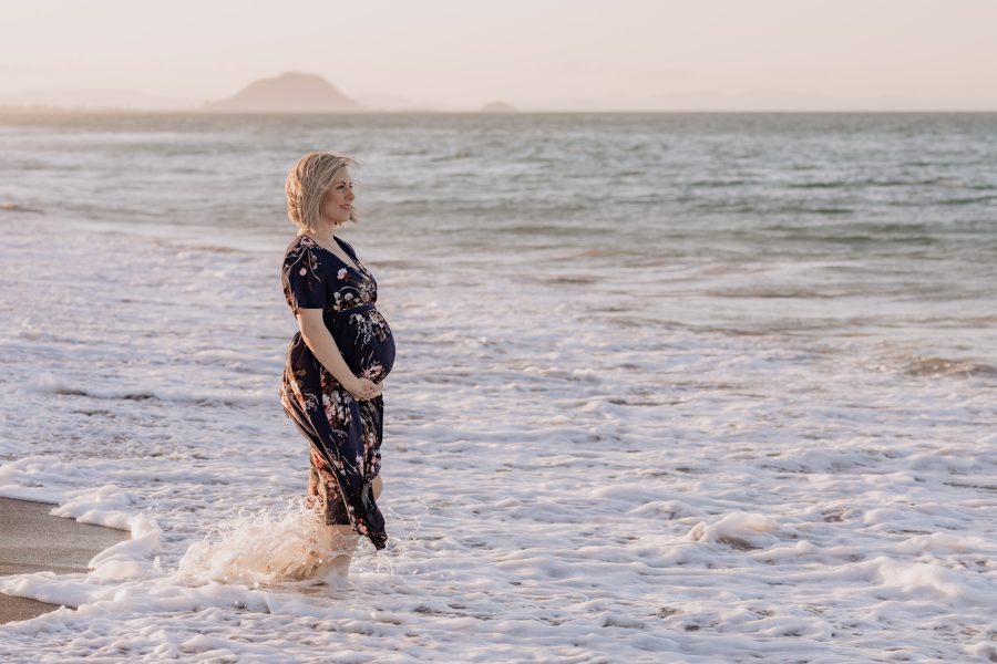 Maternity photos of pregnant Mum standing in the moving sea waters