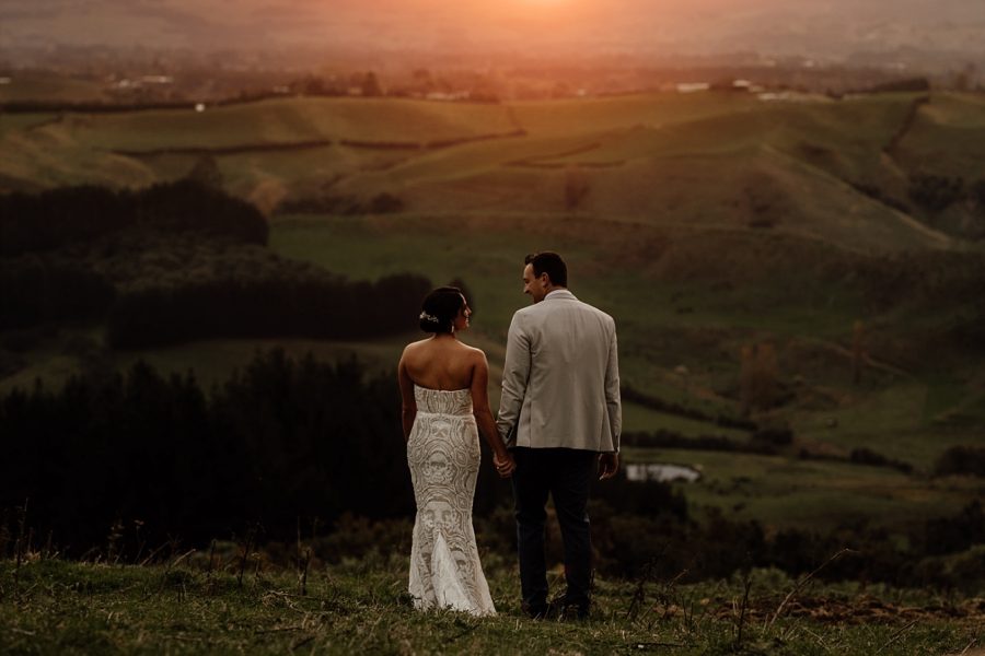 Bride and Groom at their country wedding enjoying the views above Tauranga at golden hour photo time