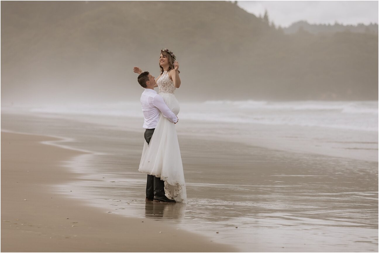 Having fun in the water wedding couple