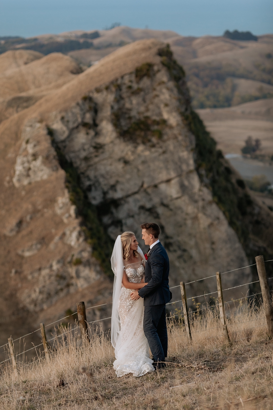 Hawkes Bay elopement photo of cliffs in background