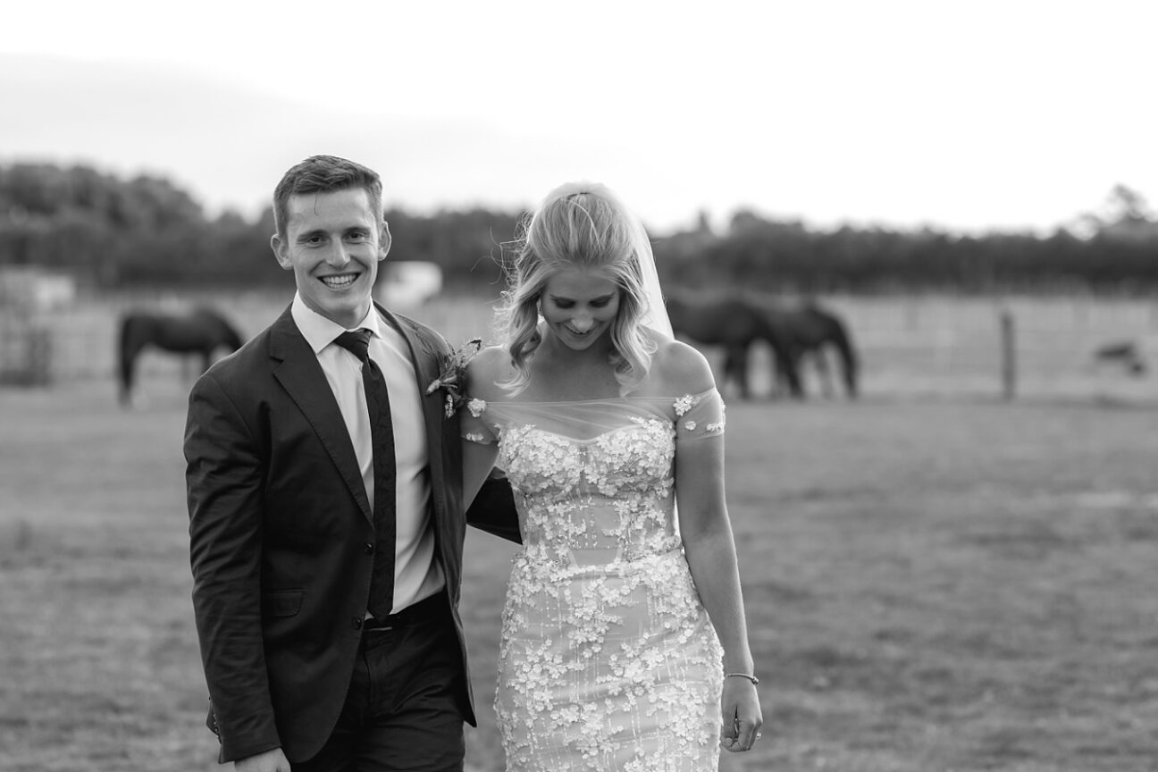 Rustic country wedding walking laughing