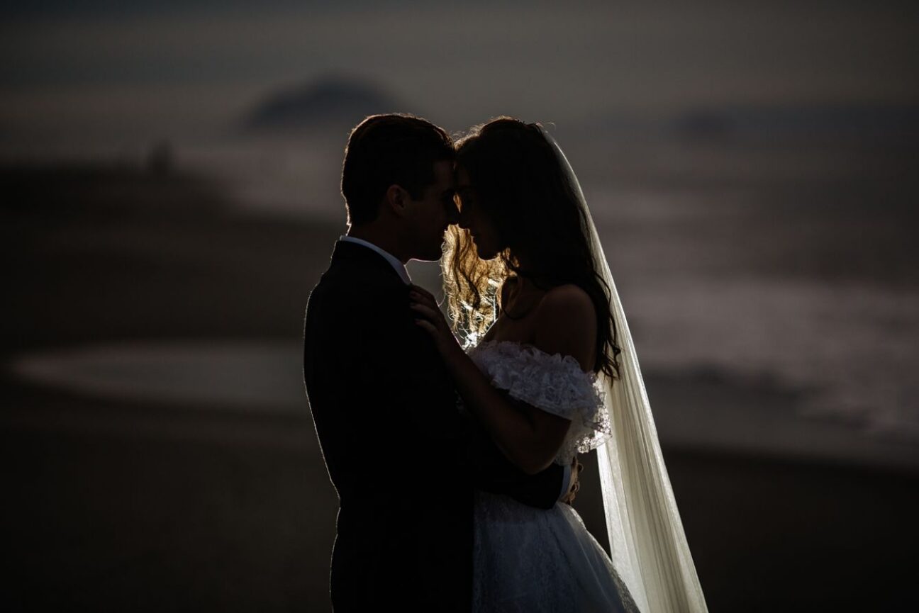 Nighttime beach shot of bride and groom