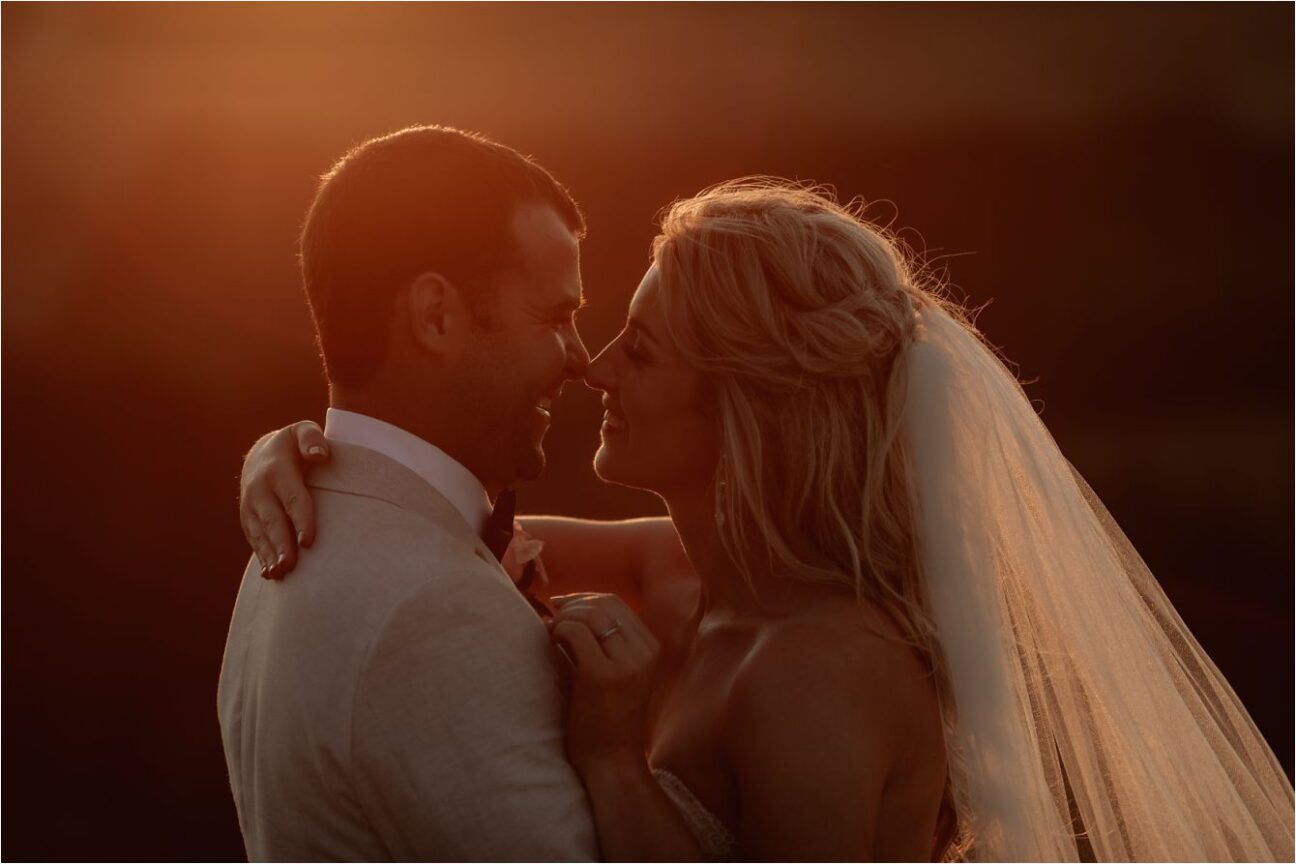 kissing photo at golden hour