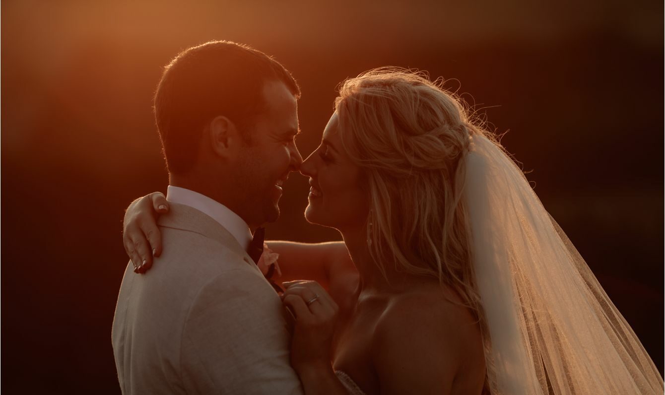 kissing photo at golden hour