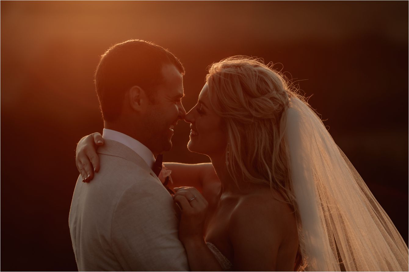 kissing photo at golden hour