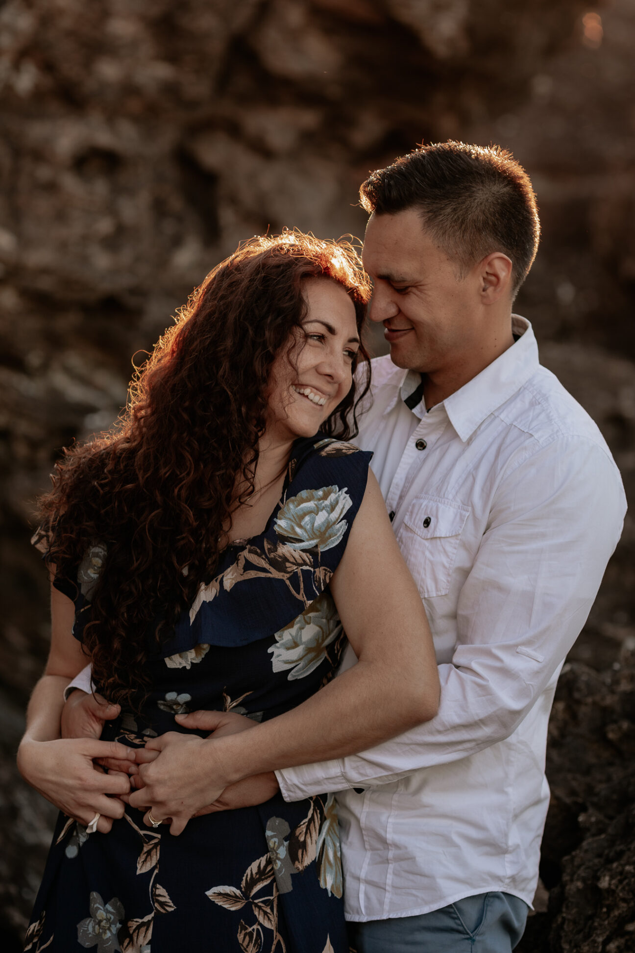 Laughing moment with couple with sunlit hair