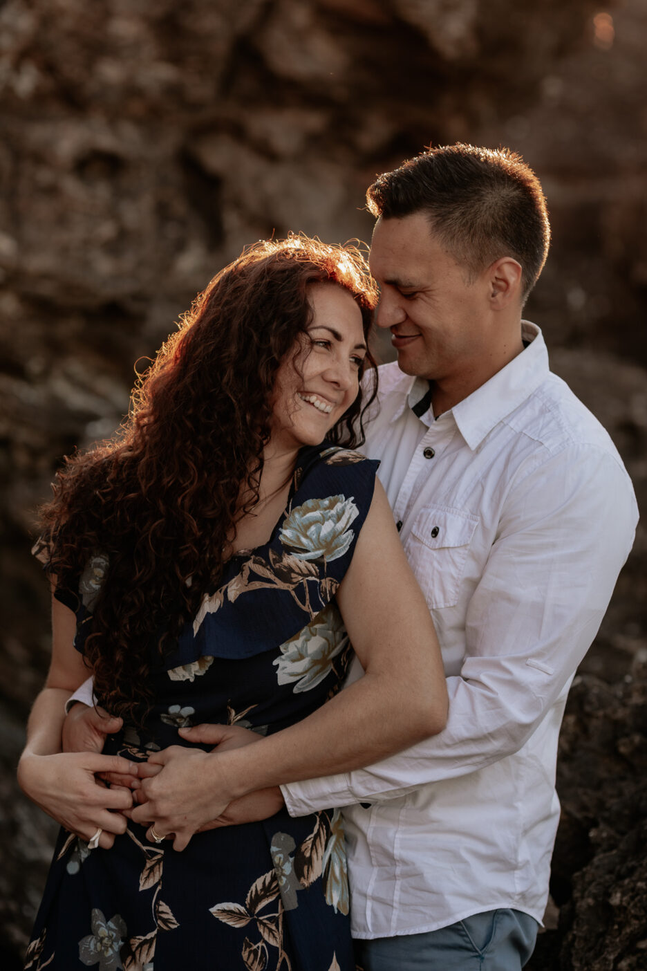 Laughing moment with couple with sunlit hair