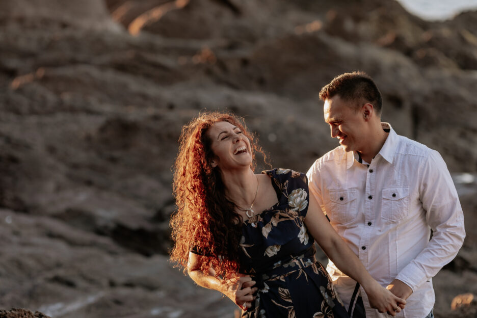Laughing couple on rocks