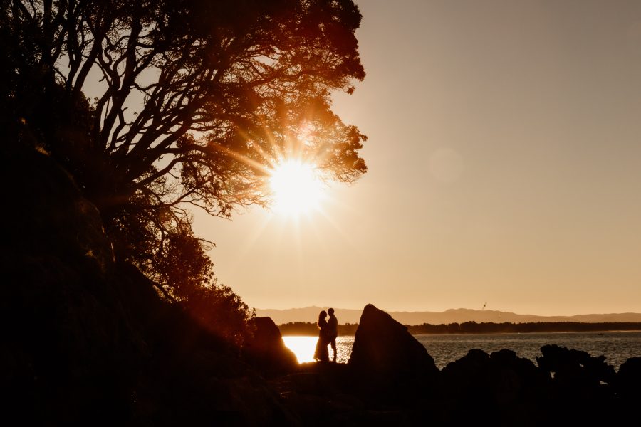 Photo of couple at Mount Maunganui with sunflare