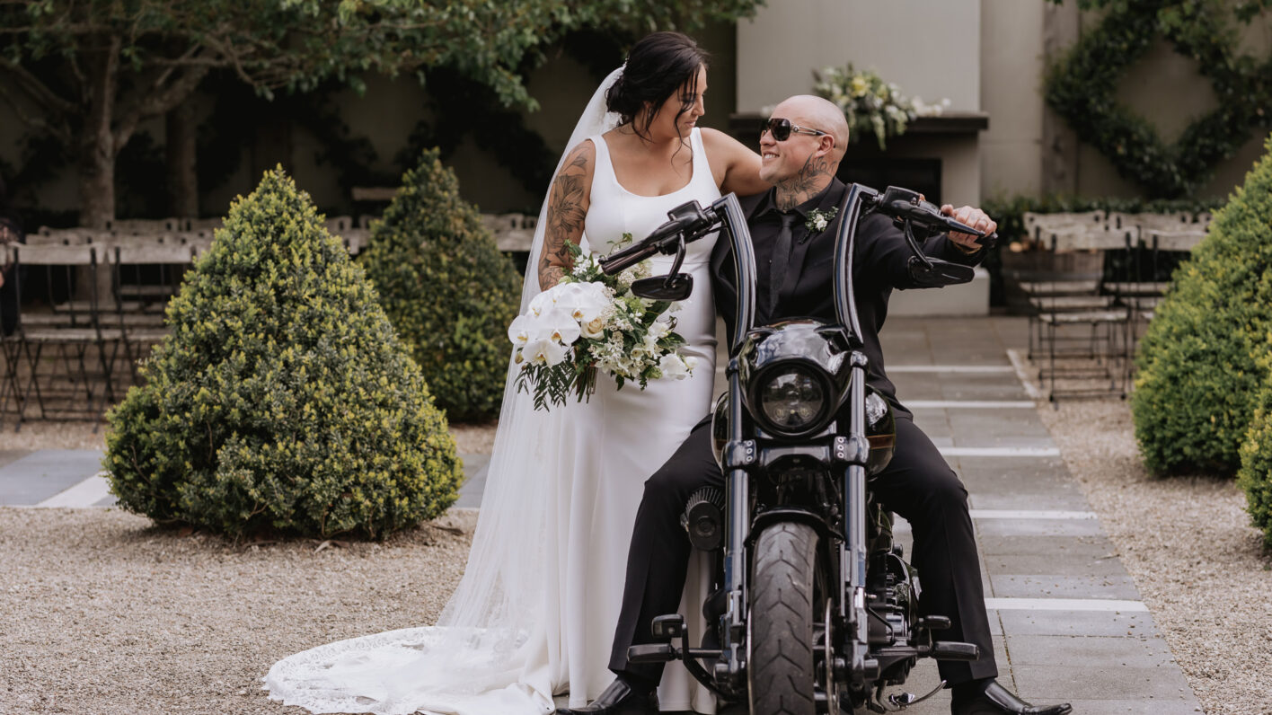 Bride and groom on Harley Davidson motor bike at Ataahua garden ceremony area