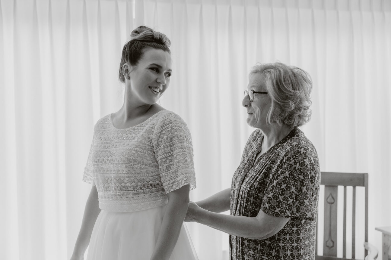 Bride and mother of bride getting ready