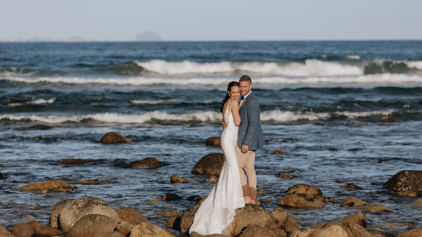 Wedding photography on the rocks at Orua Beach house
