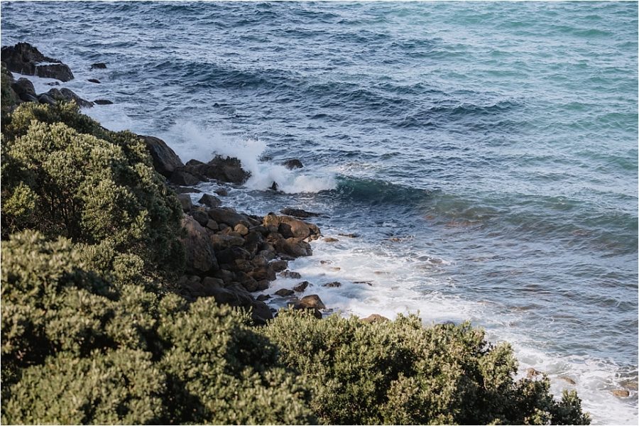 Sea crashing on rocks while ceremony in progress