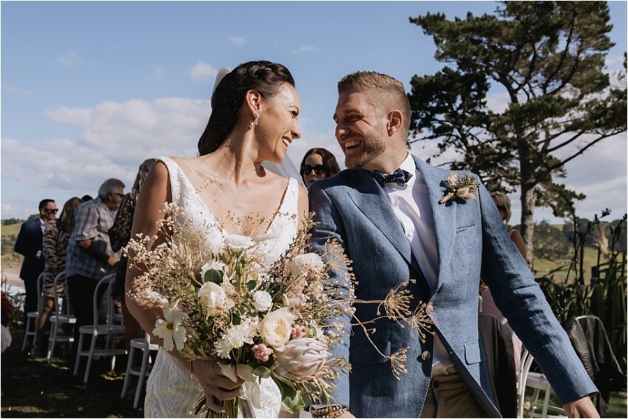 Bride and groom happy moment walking aisle