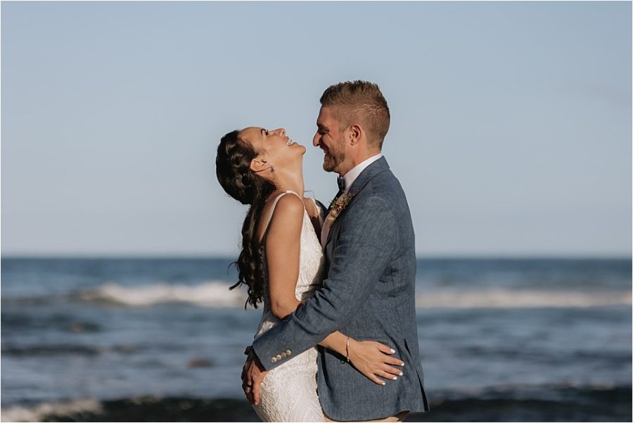 Candid wedding photos Bride laughing with husband