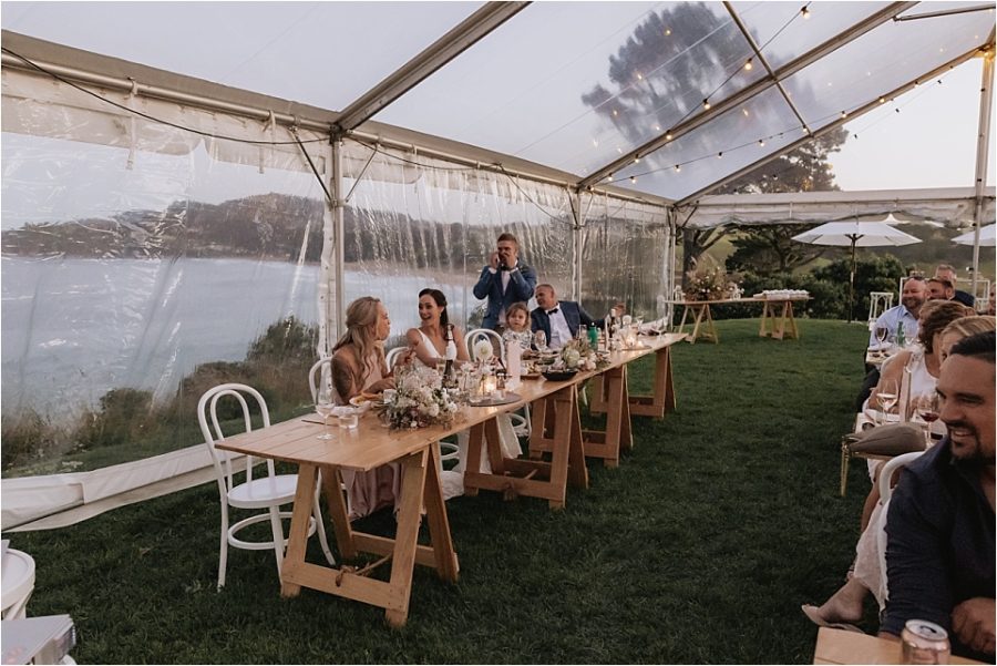 Groom gets emotional during speeches at Orua beach house reception in marquee