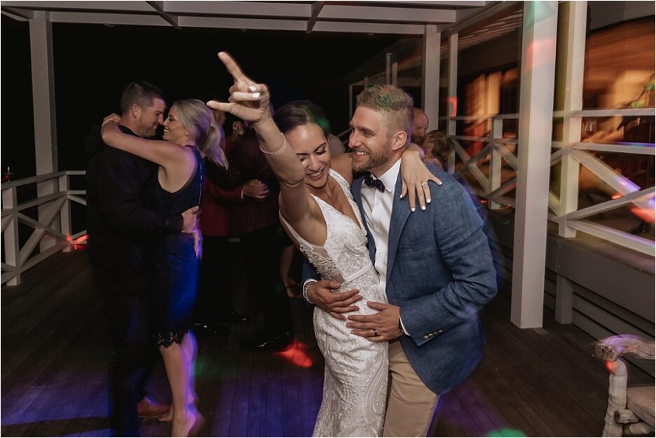 Bride and groom on the dance floor at Orua Beach house