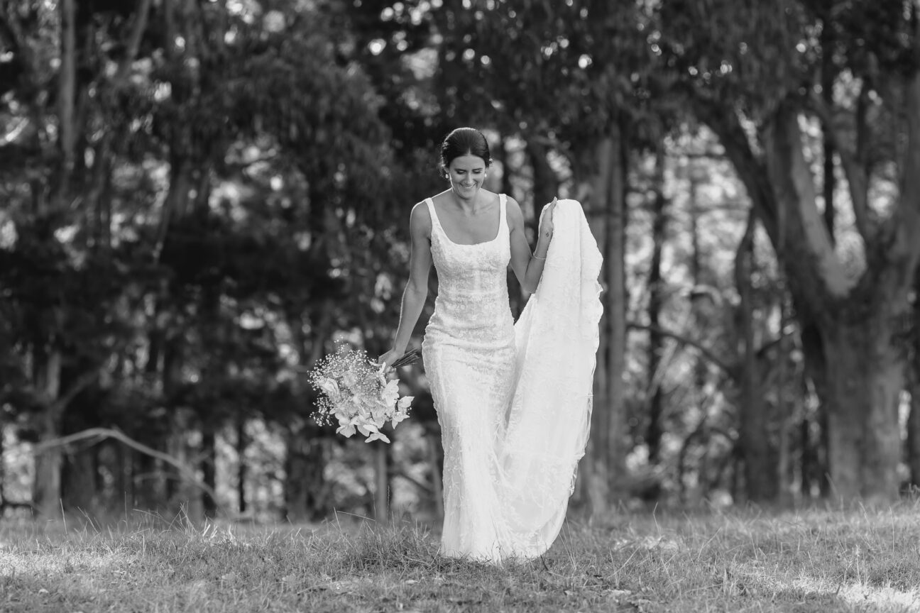 Bride lace dress walking in field