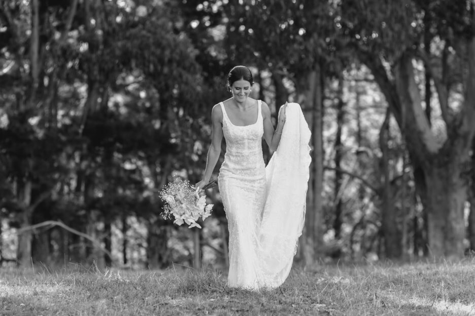 Bride lace dress walking in field