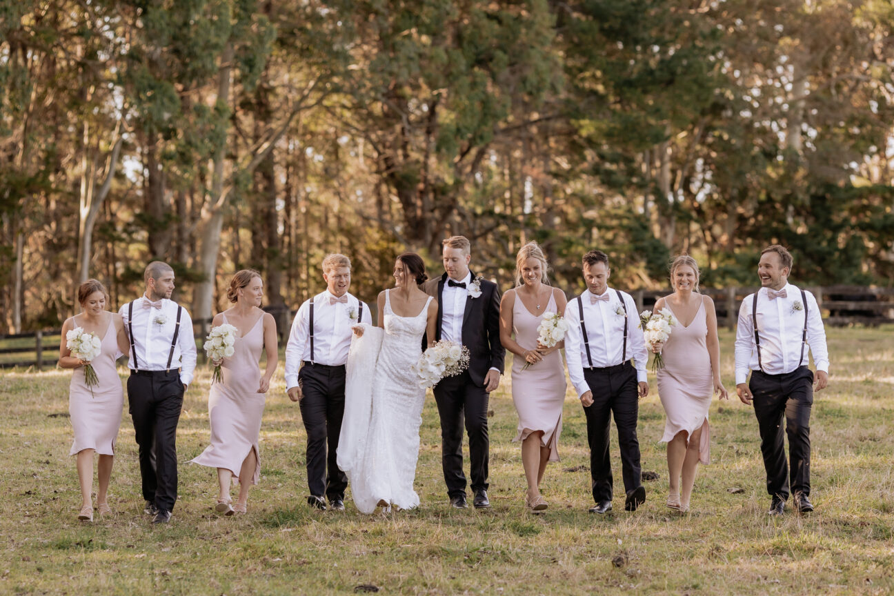 Pink bridal squad laughter and walking