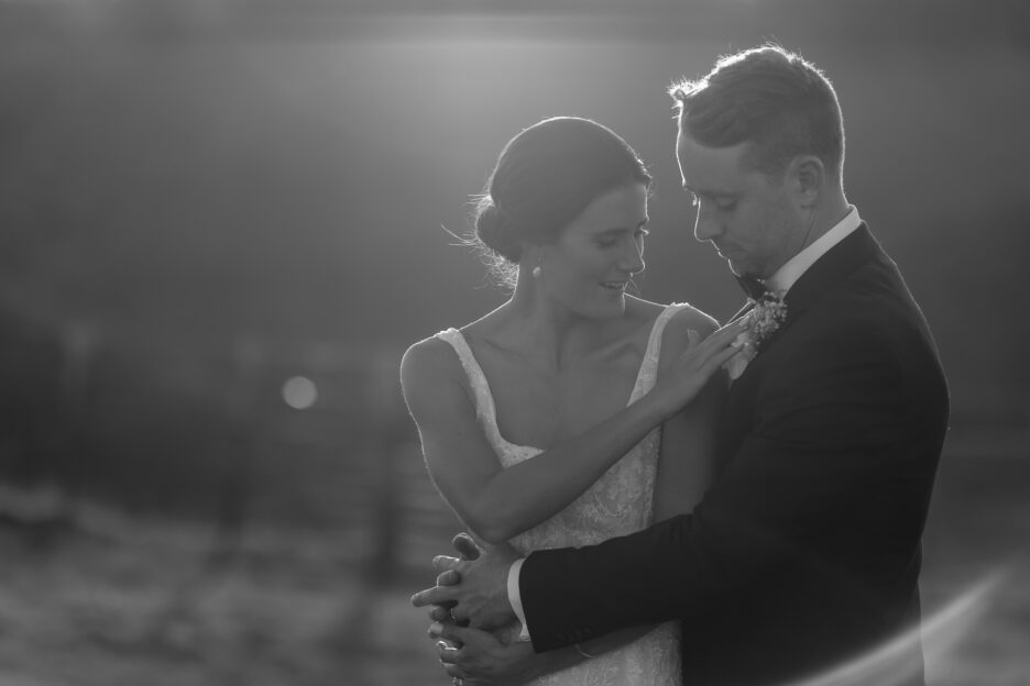 Candid moment during wedding photos bride fixes flower