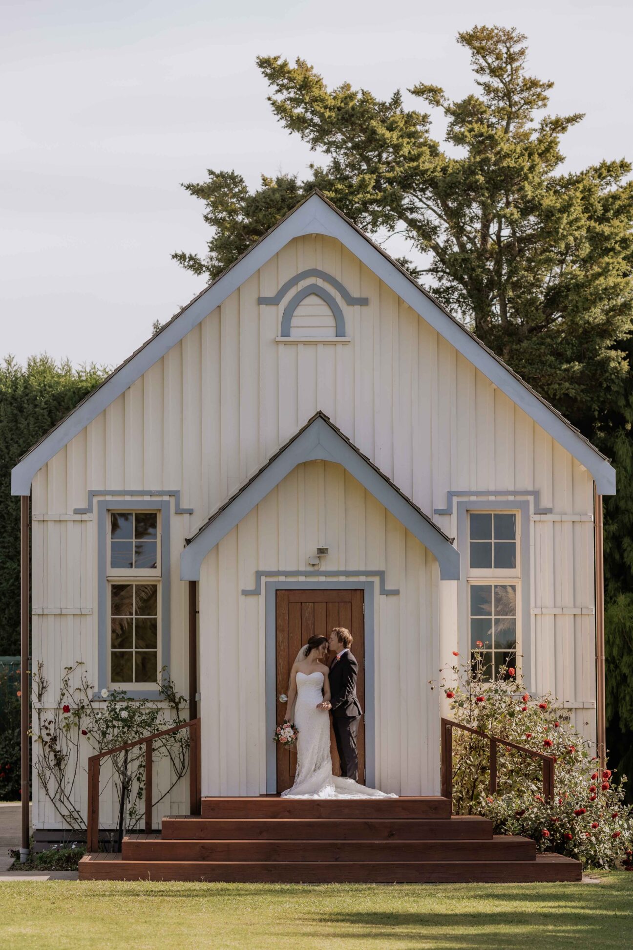 Bride and groom on steps of No 2 Road Hall