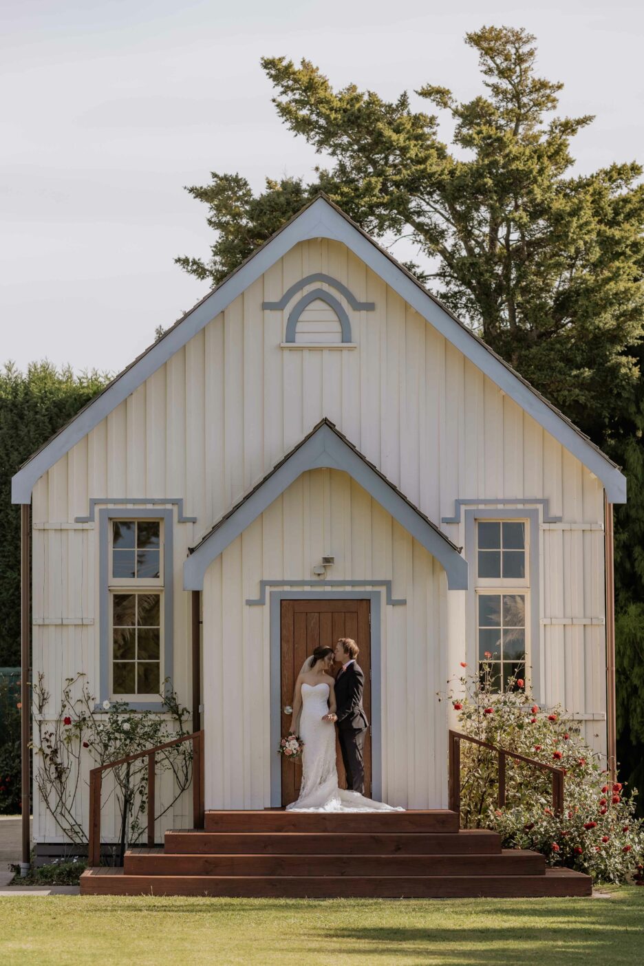 Bride and groom on steps of No 2 Road Hall