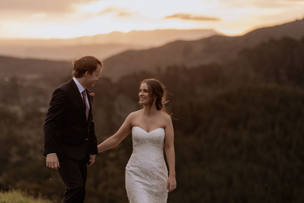 Walking in golden hour on their wedding day