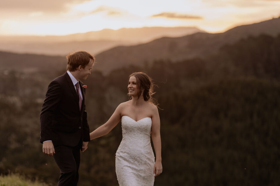 Walking in golden hour on their wedding day