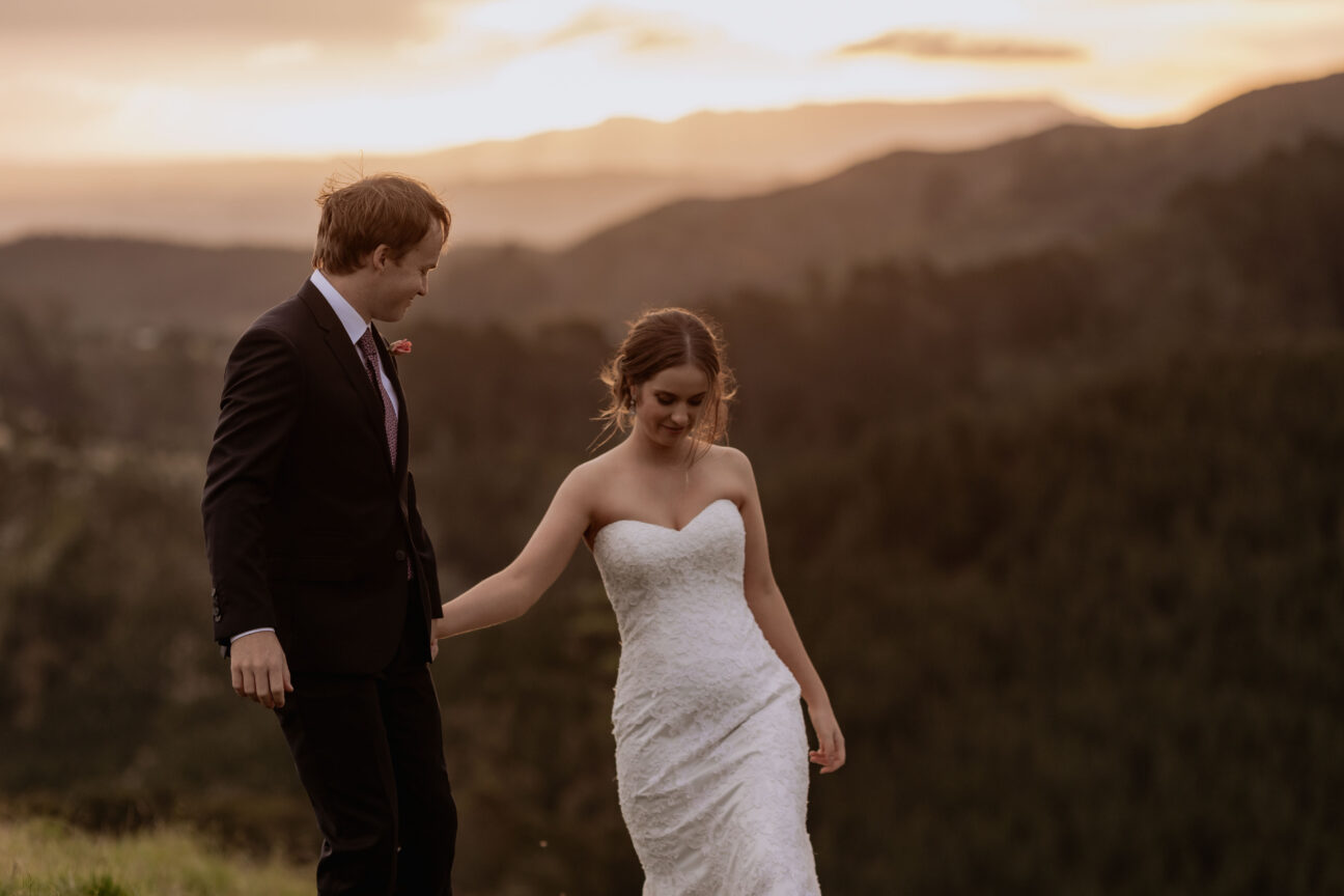 natural unposed walking bridal couple at sunset