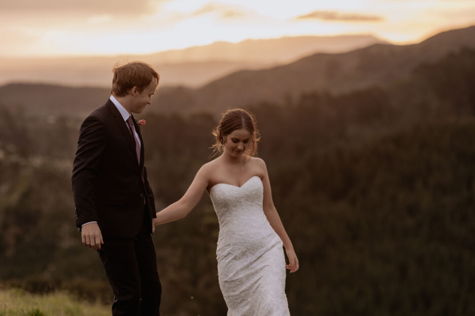 natural unposed walking bridal couple at sunset