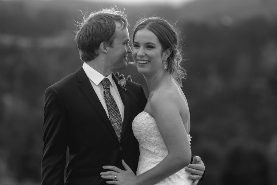 Happy candid moment of NZ Bride and Groom