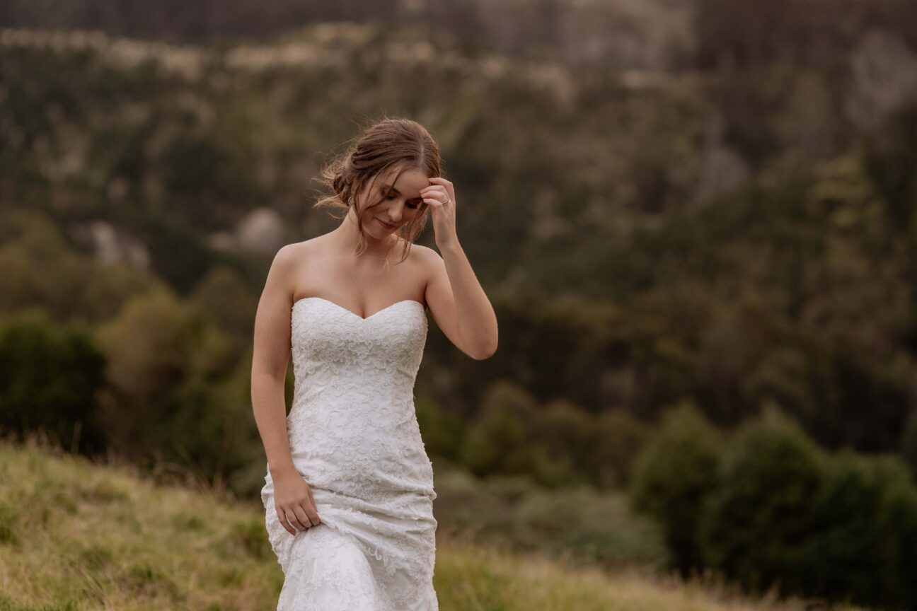 bridal portrait moves hair off face