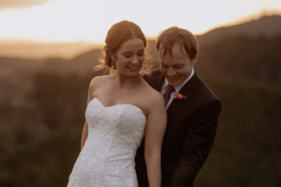 wedding couple giggling togetehr