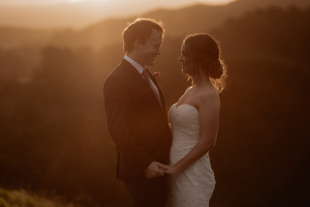 Golden light wedding photo in hills of Tauranga