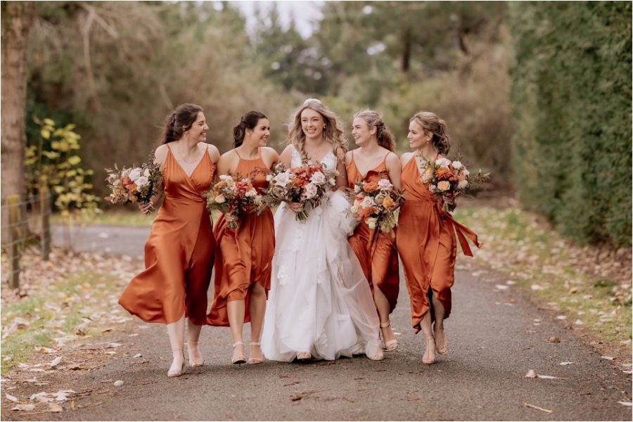 Happy laughing bride with her bridesmaids
