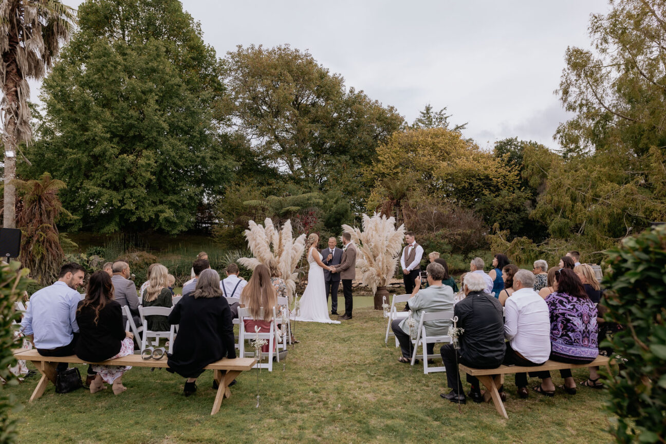 wedding ceremony in progress guests seated