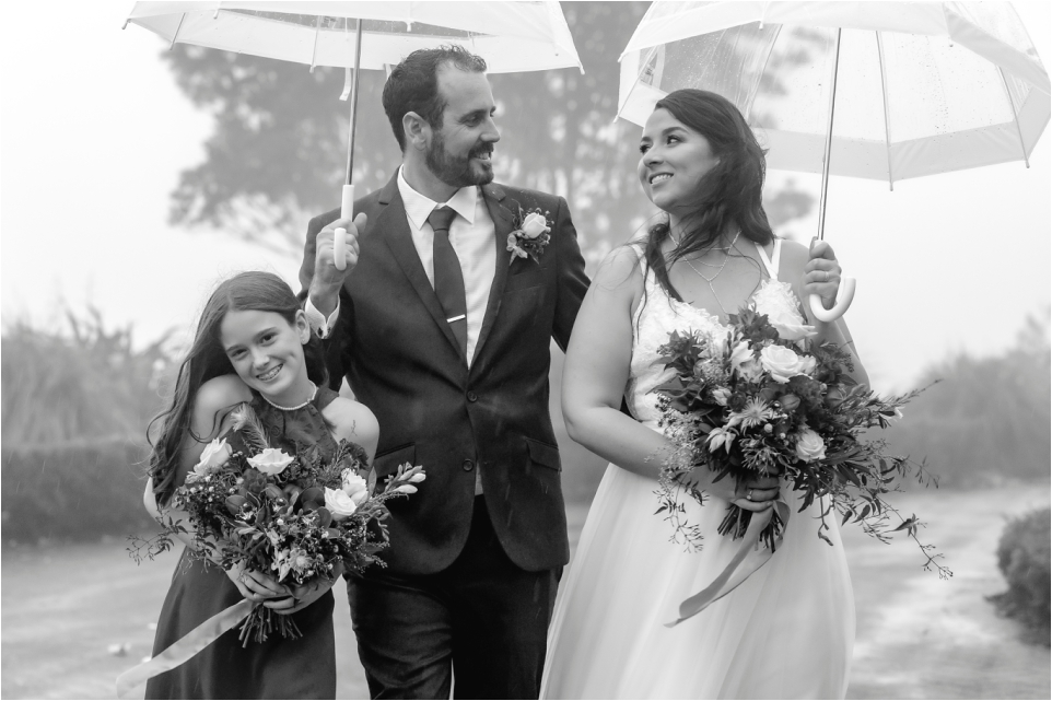 Walking with flower girl in the rain