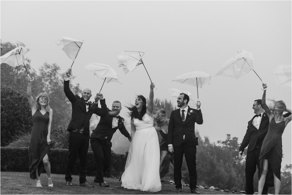 fun photos in the rain with inside out umbrellas in Tauranga hills