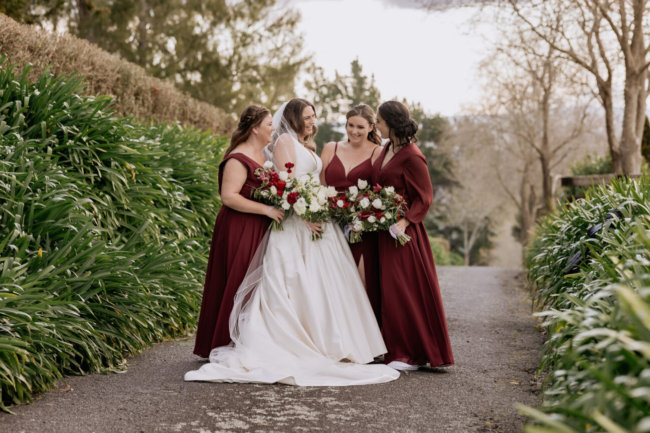Bride with bridesmaids on driveway at Eagle Ridge Estate