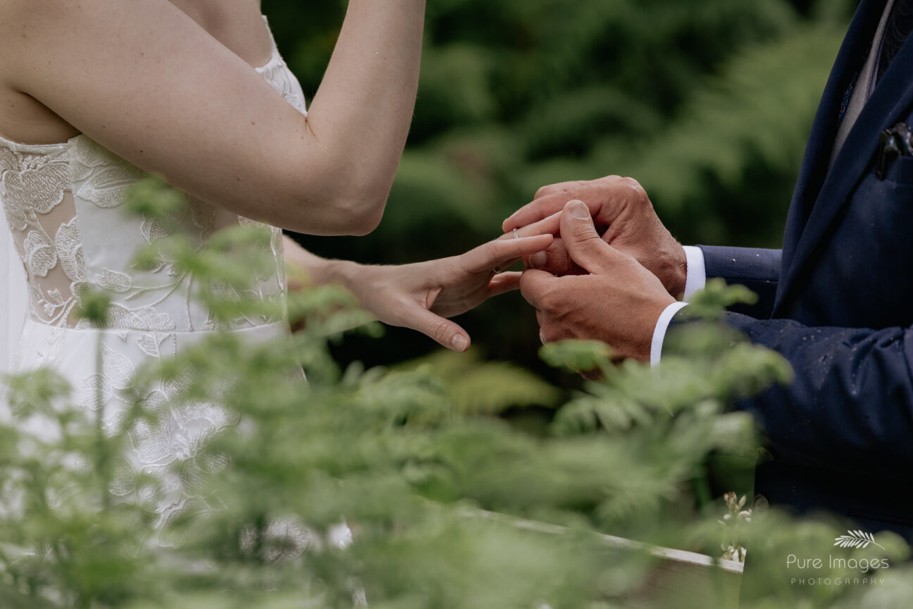 wedding rings being put on hands