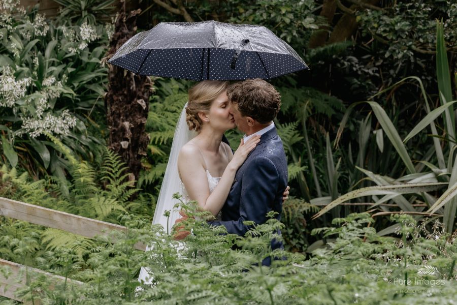 first kiss in the rain Tauranga backyard wedding wedding