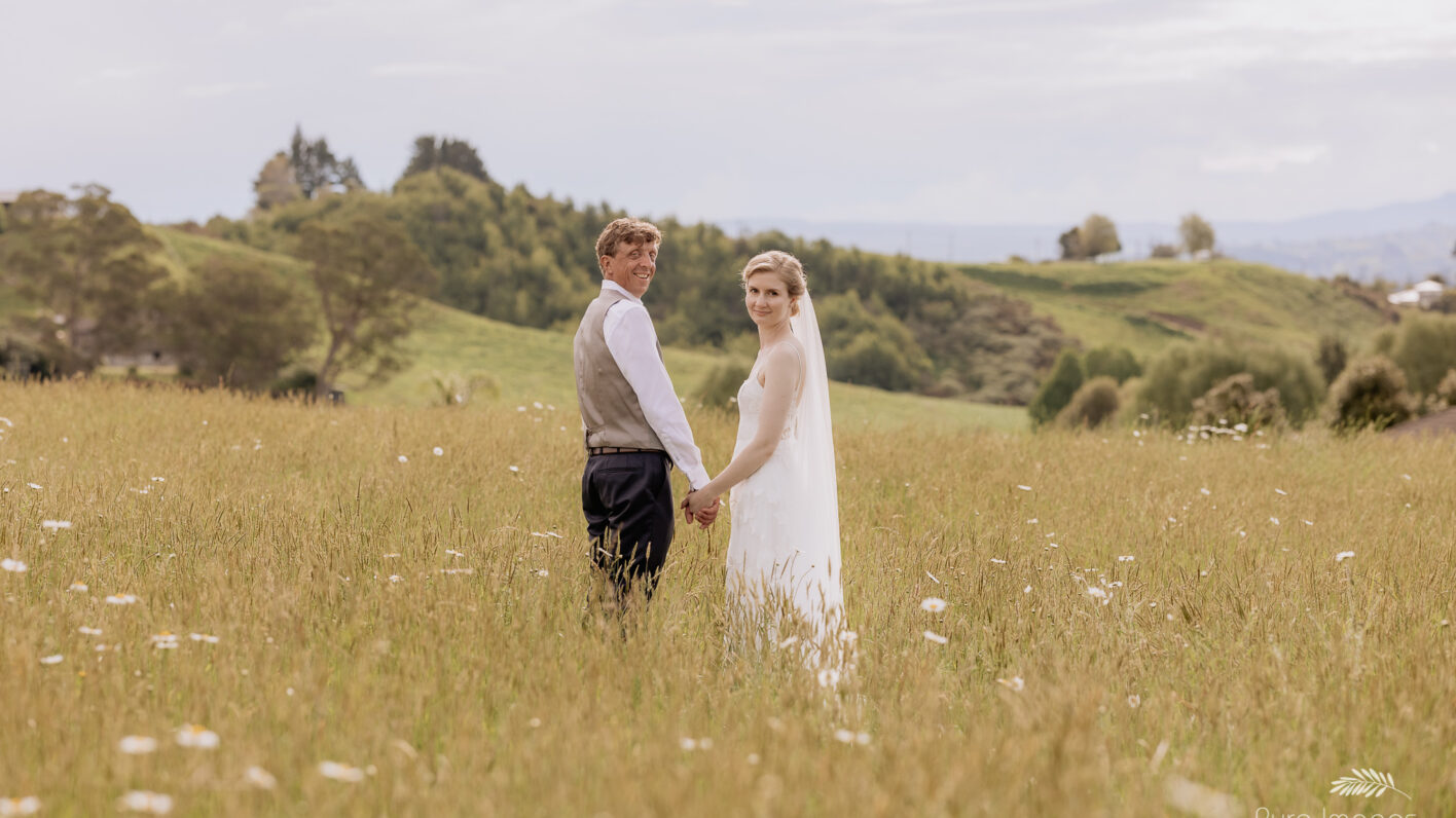 wedding couple in field