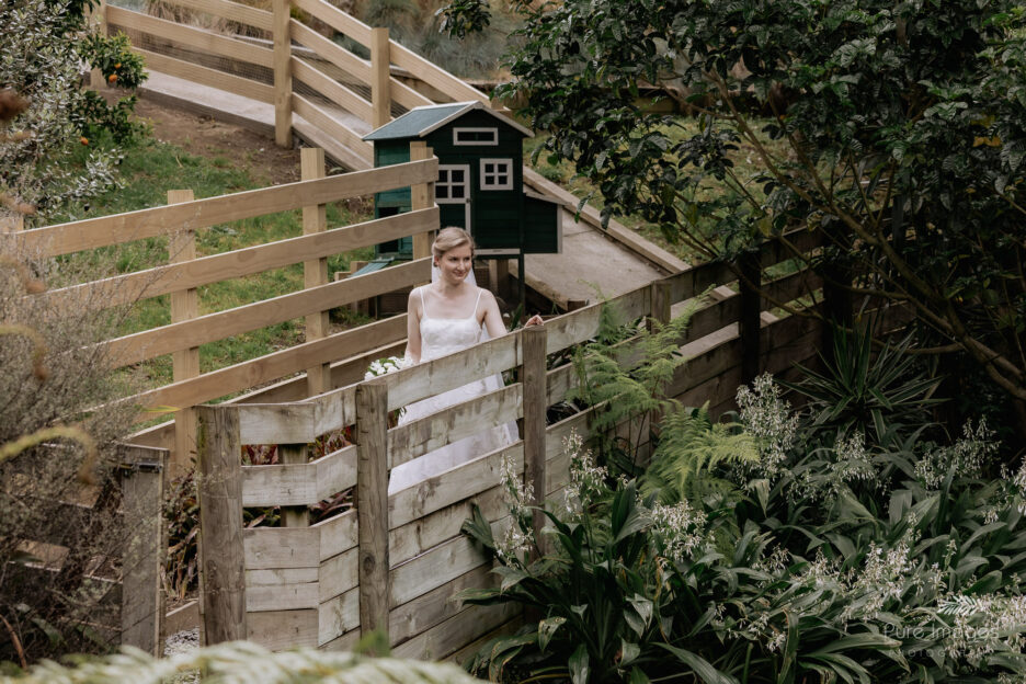 Bride walks aisle toward her groom
